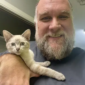 Barrett holding a cat
