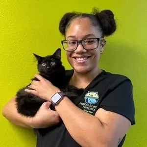 Kayla holding a black kitten